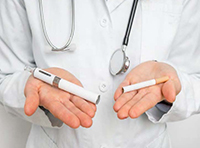 doctor holding vape e-cigarette in one hand and cigraette in other