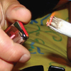 person lighting a joint
